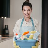 housewife-young-smiling-woman-with-basin-with-cleansing-appliances